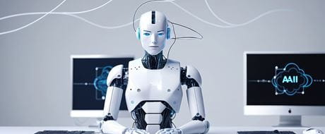Roboter sitzt vor zwei Bildschirmen Roboter sitzt vor zwei Bildschirmen